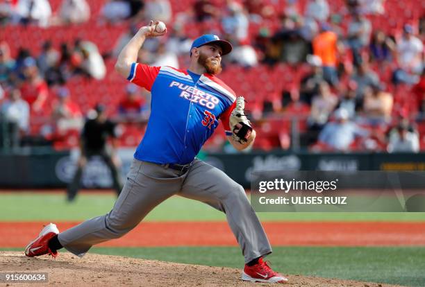 Robby Rowland, Criollos de Caguas of Puerto Rico, pitches against Caribes de Anzoategui of Venezuela during the Caribbean Baseball Series at the...