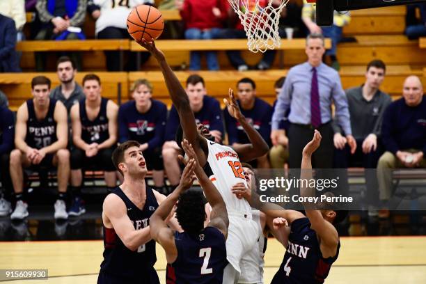 Myles Stephens of the Princeton Tigers scores against the Pennsylvania Quakers during the first half at L. Stockwell Jadwin Gymnasium on February 6,...