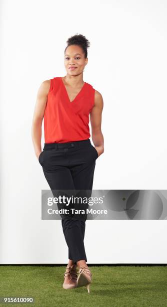 woman standing looking relaxed - svarta byxor bildbanksfoton och bilder