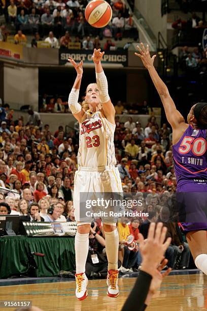 Katie Douglas of the Indiana Fever shoots against Tangela Smith of the Phoenix Mercury during Game Four of the WNBA Finals on October 7, 2009 at...