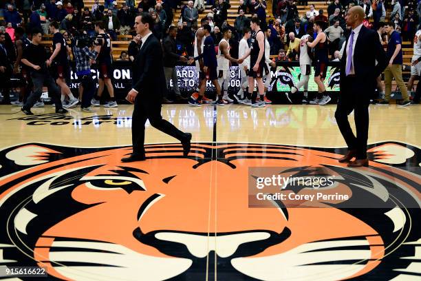 Head coach Steve Donahue of the Pennsylvania Quakers walks off the court as teams shake hands after the game at L. Stockwell Jadwin Gymnasium on...