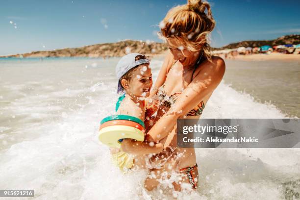 enjoying sea water - beach holiday stock pictures, royalty-free photos & images