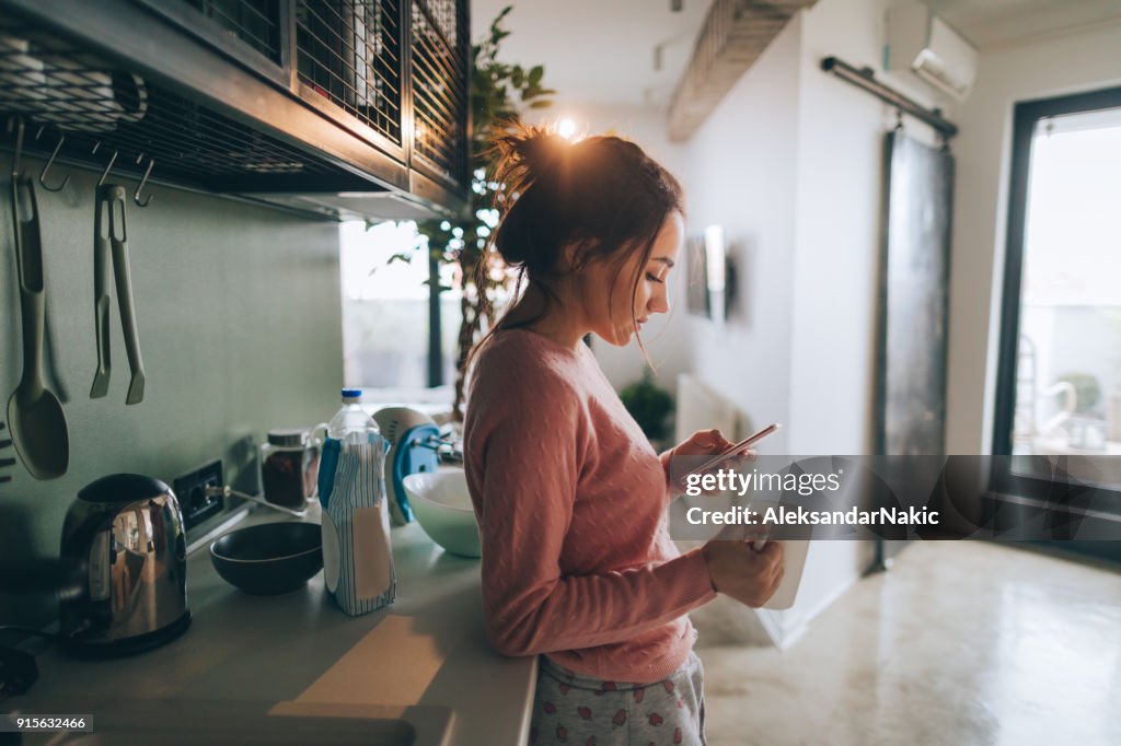 Young woman drinking first morning coffee