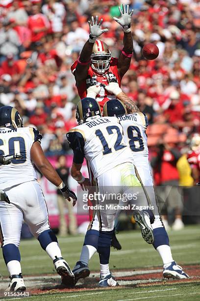 Manny Lawson of the San Francisco 49ers pressures Kyle Boller of the St. Louis Rams during the NFL game at Candlestick Park on October 4, 2009 in San...