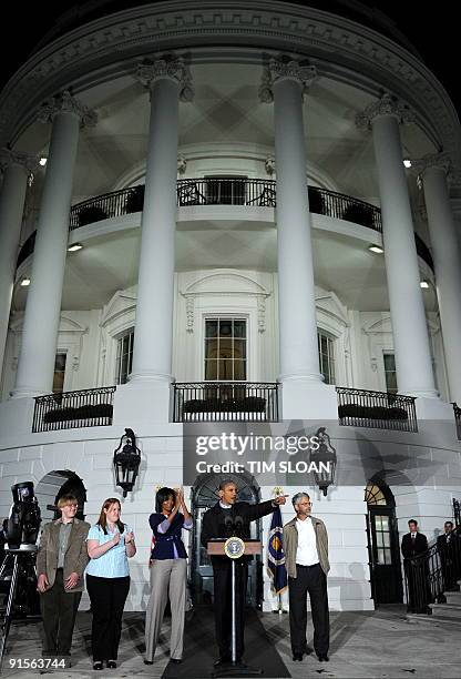 President Barack Obama, his wife Michele, and Science Advisor John Holdren make remarks during an event for local middle school students to star gaze...