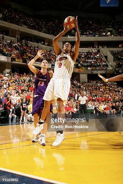 Tammy Sutton-Brown of the Indiana Fever shoots against Penny Taylor of the Phoenix Mercury during Game Four of the WNBA Finals on October 7, 2009 at...