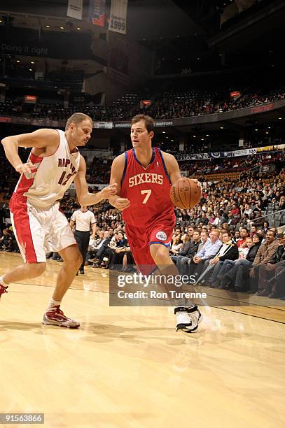 Primoz Brezec of the Philadelphia 76ers tries to get to the rim past Rasho Nesterovic of the Toronto Raptors during a game on October 7, 2009 at the...