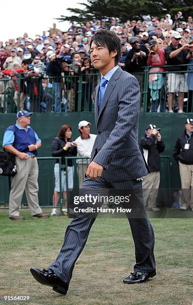 Ryo Ishikawa of the International Team makes his way to the stage during Opening Ceremony of The Presidents Cup at Harding Park Golf Course on...