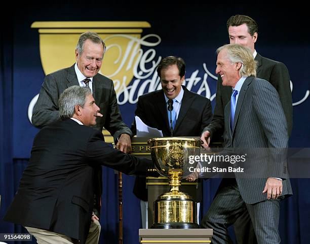 Presidents Cup Captains Fred Couples, left, and Greg Norman, right, sake hands to officially start The Presidents Cup at Harding Park Golf Club on...