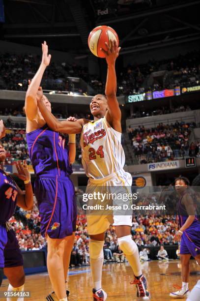 Tamika Catchings of the Indiana Fever shoots against Nicole Ohlde of the Phoenix Mercury during Game Four of the WNBA Finals on October 7, 2009 at...