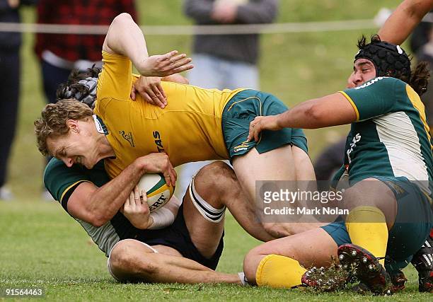 Ryan Cross is tackled during an Australian Wallabies training session at St Ignatius College on October 8, 2009 in Sydney, Australia.