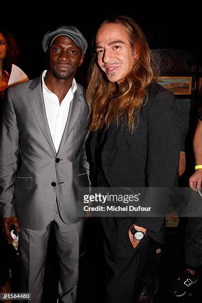 Claude Makelele and John Galliano attend John Galliano Pret a Porter show as part of the Paris Womenswear Fashion Week Spring/Summer 2010 at Halle...