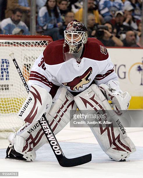 Ilya Bryzgalov of the Phoenix Coyotes watches play in the corner against the Pittsburgh Penguins in the third period at Mellon Arena on October 07,...