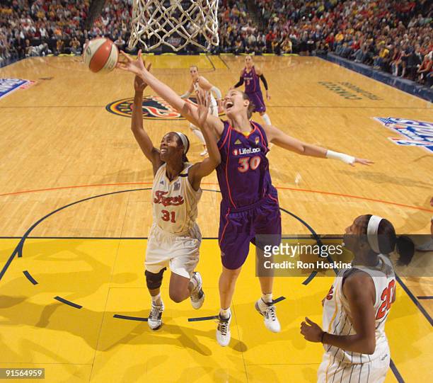 Nicole Ohlde of the Phoenix Mercury battles Jessica Moore of the Indiana Fever during Game Four of the WNBA Finals at Conseco Fieldhouse on October...