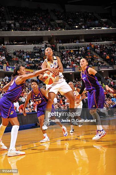 Briann January of the Indiana Fever shoots against Tangela Smith of the Phoenix Mercury during Game Four of the WNBA Finals on October 7, 2009 at...