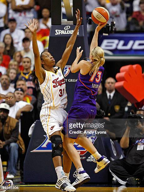Penny Taylor of the Phoenix Mercury shoots the ball while defended by Jessica Moore of the Indiana Fever during the WNBA Finals game 4 at Conseco...