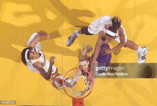 Penny Taylor of the Indiana Fever battles Jessica Moore and Tamecka Dixon of the Indiana Fever during Game Four of the WNBA Finals at Conseco...