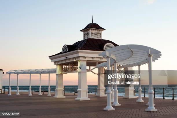 beach and boardwalk at dawn in long branch nj - long branch, new jersey stock pictures, royalty-free photos & images