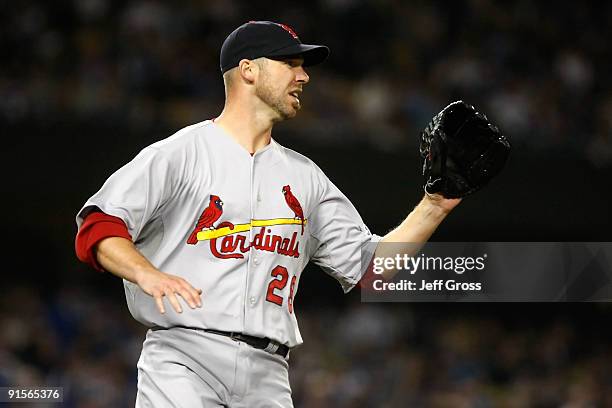 Pitcher Chris Carpenter of the St. Louis Cardinals waits to catch the ball against the Los Angeles Dodgers in Game One of the NLDS during the 2009...