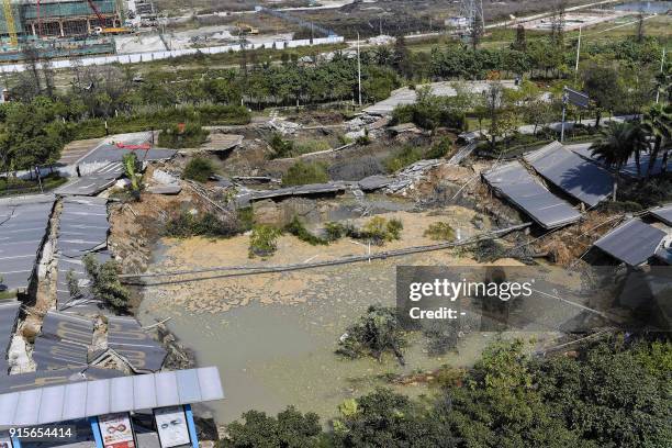 This overview shows the accident site after a road collapse in Foshan in China's southern Guangdong province on February 8, 2018. Eight people died...