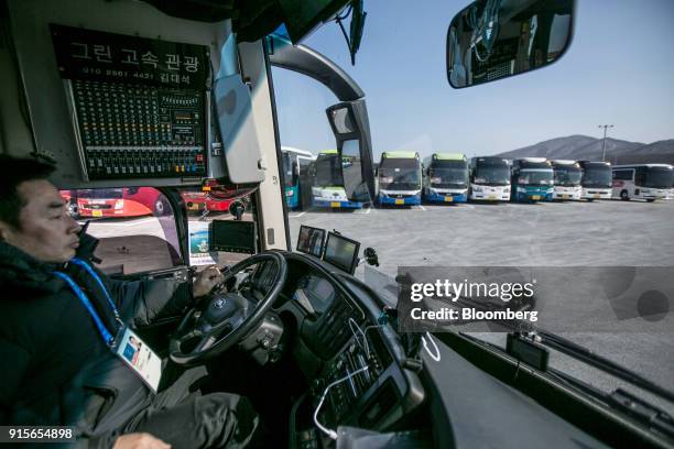 Bus driver onboard a shuttle bus for the 2018 PyeongChang Winter Olympic Games, manufactured by Kia Motors Corp., at the Daegwallyeong Transport Mall...