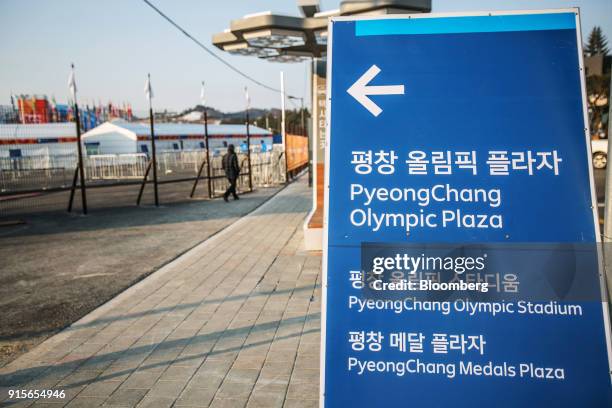 Sign directing visitors towards venues for the 2018 PyeongChang Winter Olympic Games stands in the Hoenggye-ri village area of Pyeongchang, Gangwon...