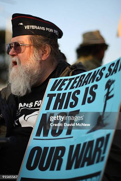 Vietnam veteran Jack Finley joins anti-war demonstrators in calling for a troop pullout in Afghanistan as they rally near the Federal Building eight...