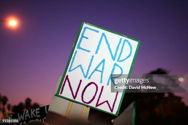 Anti-war demonstrators call for a troop pullout in Afghanistan as they rally near the Federal Building eight years after the start of the war on...