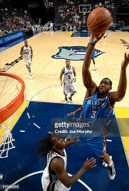 White of the Oklahoma City Thunder shoots over DeMarre Carroll of the Memphis Grizzlies on October 7, 2009 at at FedExForum in Memphis, Tennessee....