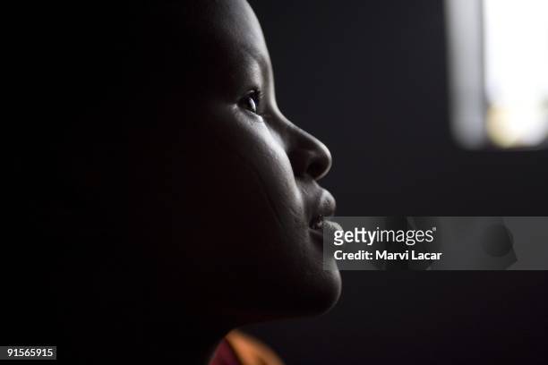 Renu Regina Masiaine poses for a portrait inside her dormroom at the Tasaru Safehouse for Girls December 20, 2006 in Narok, Kenya. The Tasaru...