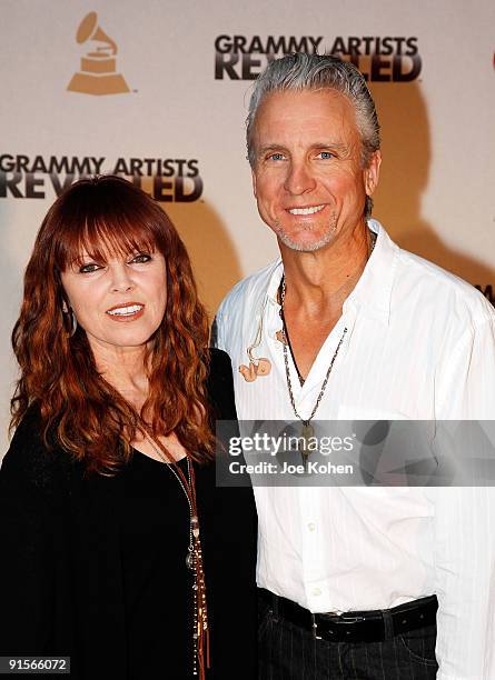 Singer Pat Benatar and musician Neil Giraldo pose for a photo backstage during The Recording Academy's New GRAMMY Artists Revealed Series kick off at...