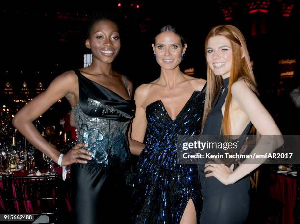 Models Oluwatoniloba Dreher-Adenuga, Heidi Klum, and Klaudia Anna Giez attend the 2018 amfAR Gala New York at Cipriani Wall Street on February 7,...