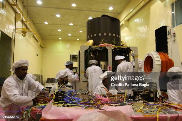 Space engineers at work in making the Chandryaan-2 spacecraft. The Indian Space Research Organisation or ISRO is putting finishing touches to India's...