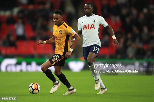 Shawn McCoulsky of Newport County in action with Victor Wanyama of Tottenham Hotspur during the FA Cup Fourth Round replay between Tottenham Hotspur...