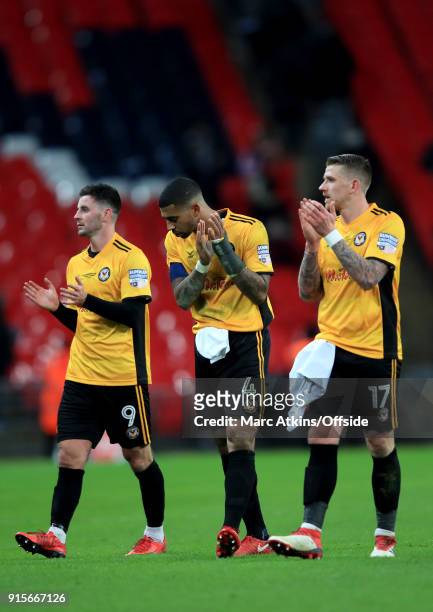 Padraig Amond, Joss Labadie and Scot Bennett of Newport County during the FA Cup Fourth Round replay between Tottenham Hotspur and Newport County at...