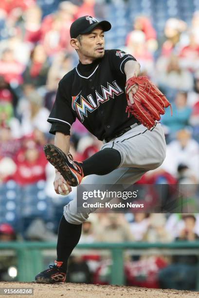 Photo taken on Oct. 4 shows Miami Marlins outfielder Ichiro Suzuki making his first MLB pitching appearance during a game against the Philadelphia...