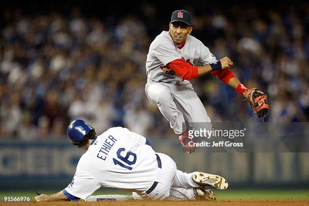 Julio Lugo of the St. Louis Cardinals turns a double-play in the seventh inning as Andre Ethier of the Los Angeles Dodgers is out at second base on a...
