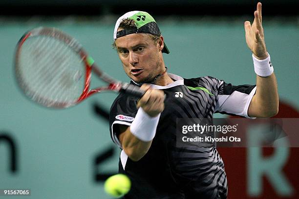 Lleyton Hewitt of Australia returns a shot in his match against Fabrice Santoro of France during day four of the Rakuten Open Tennis tournament at...