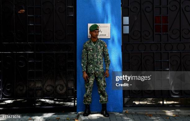 Maldives soldier stands guard outside the president's residence in Male on February 8, 2018. The international community has censured Maldives...