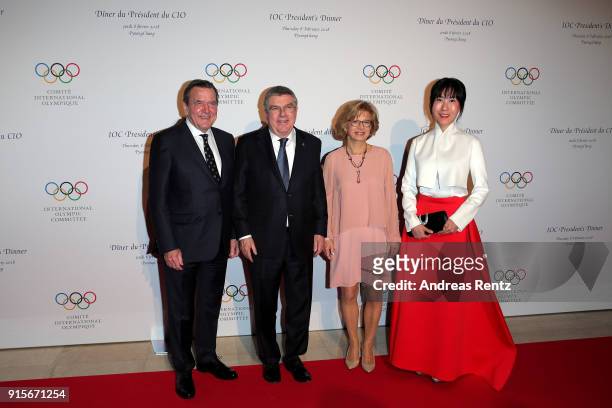President Thomas Bach and his wife Claudia Bach pose with Former Chancellor of Germany Gerhard Schroder and his partner So-Yeon Kim at the IOC...