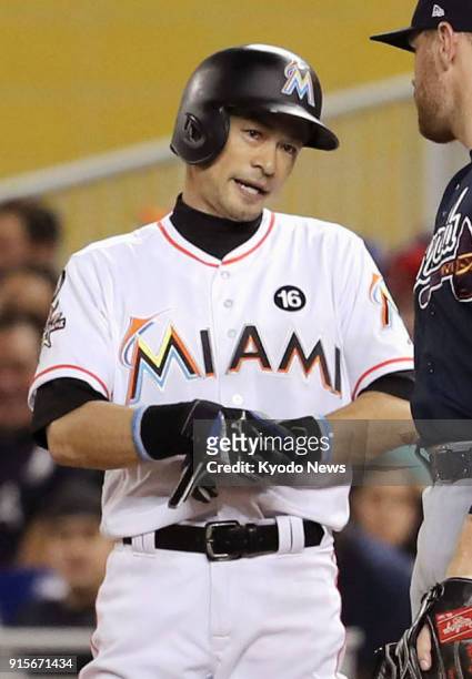 Ichiro Suzuki of the Miami Marlins, in this file photo taken on Sept. 28 reaches first base on a single in a game against the Atlanta Braves at...