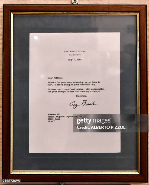 Framed letter from former US president George Bush is displayed on the wall at the Il Vero Alfredo Restaurant in Rome on February 7, 2018 as it...