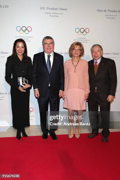 President Jean Todt and partner Michelle Yeoh pose with Former Chancellor of Germany Gerhard Schroder and his partner So-Yeon Kim at the IOC...