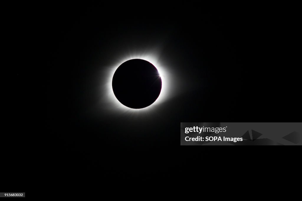 The total eclipse of the sun. The rays of light appear as...