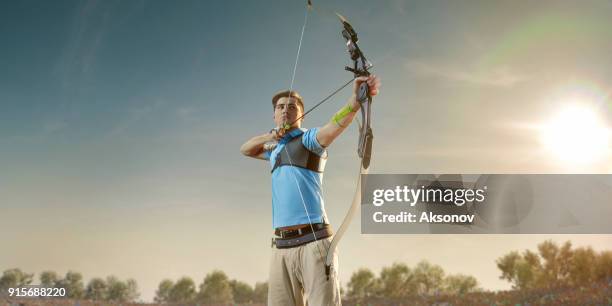 tiro con l'arciere maschio con il longbow al tramonto - tiro con l'arco foto e immagini stock