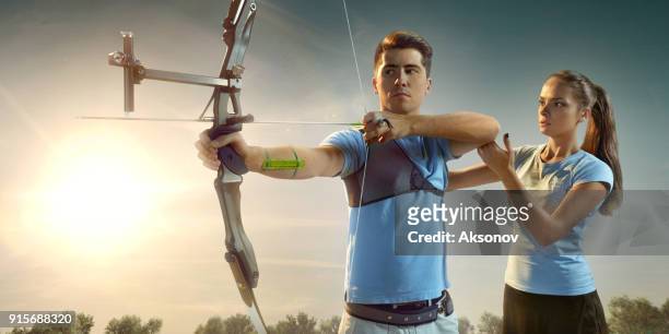 female archer teaches archery - archery range stock pictures, royalty-free photos & images