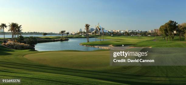 View from behind the green on the par 5, 10th hole with the clubhouse in the distance at the Dubai Creek Golf Club on February 1, 2018 in Dubai,...