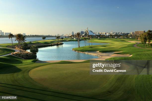 View from behind the green on the par 5, 10th hole with the clubhouse in the distance at the Dubai Creek Golf Club on February 1, 2018 in Dubai,...