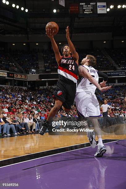 Andre Miller of the Portland Trail Blazers gets to the basket against Andres Nocioni of the Sacramento Kings during a preseason game on October 7,...