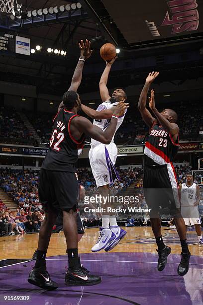 Melvin Ely of the Sacramento Kings shoots the ball over Greg Oden of the Portland Trail Blazers during a preseason game on October 7, 2009 at ARCO...
